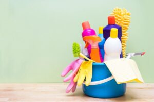 Cleaning supplies in a bucket