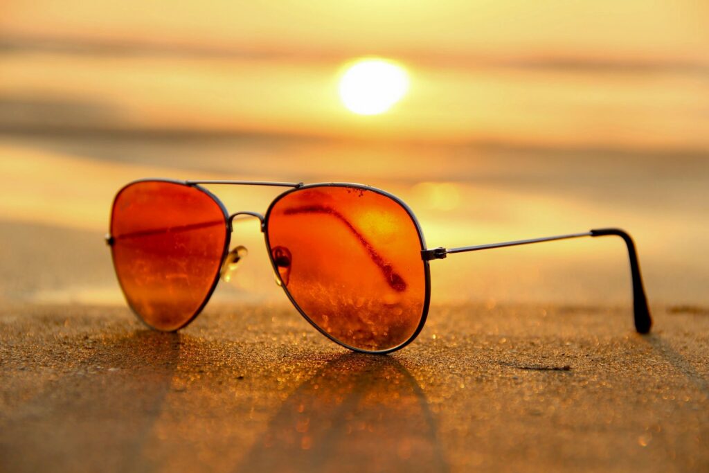sunglasses with sunset in the background